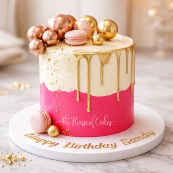 Pink white and gold cake